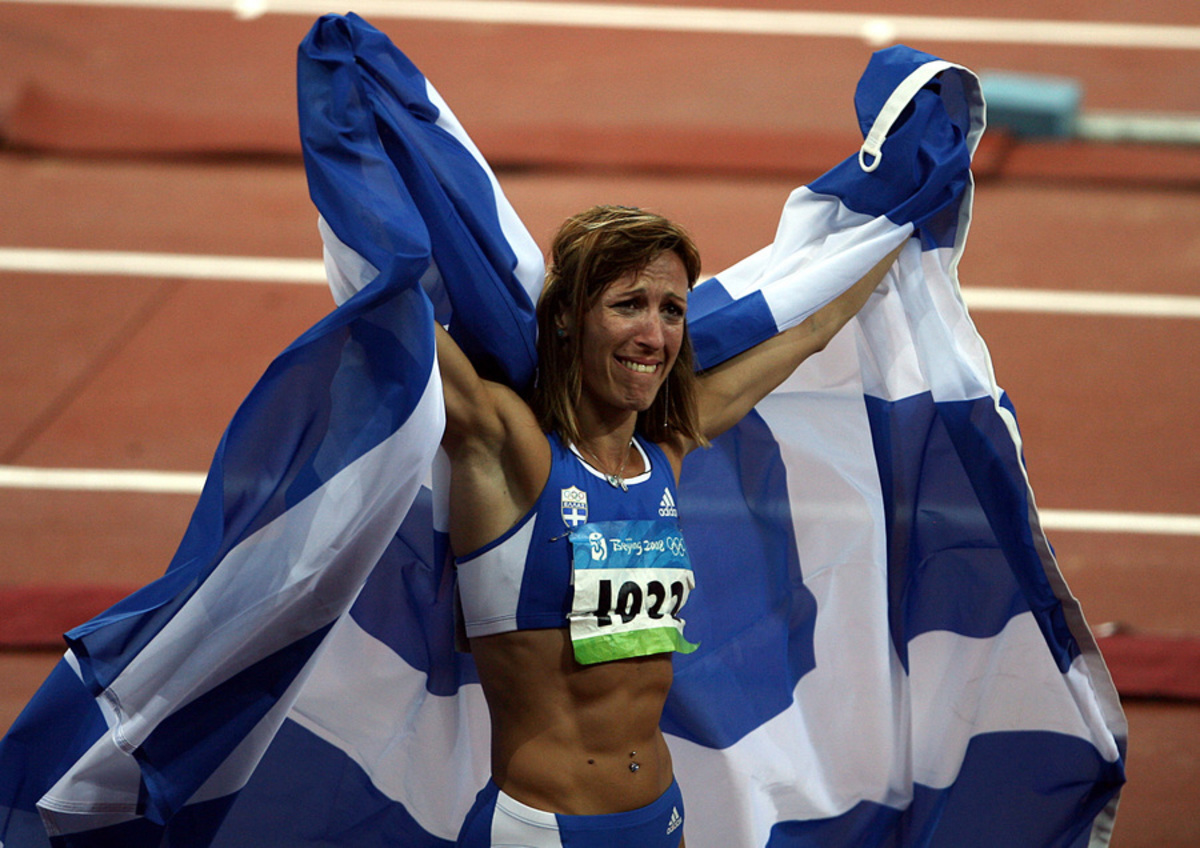 Ç ×ñõóïðçãÞ ÄåâåôæÞ  ðáíçãõñßæåé ôçí êáôÜêôçóç ôçò ôñßôçò èÝóçò êáé ôï ÷Üëêéíï ìåôÜëëéï óôï ôñéðëïýí , Ðåêßíï , 17 Áõãïýóôïõ 2008.